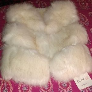 White fur vest